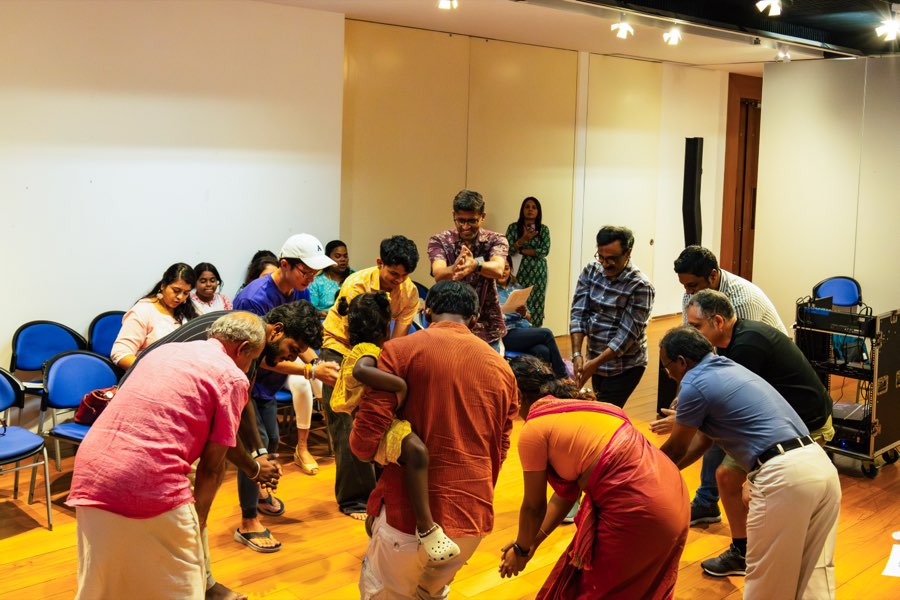 Participants working in a circle during the folk singing session