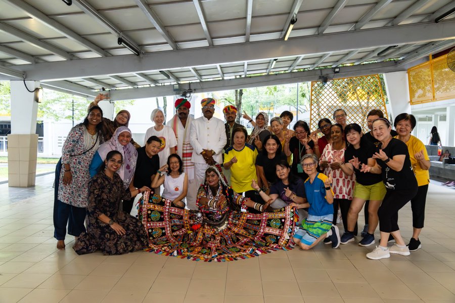 The Kalbeliya cohort with the master artist in costume