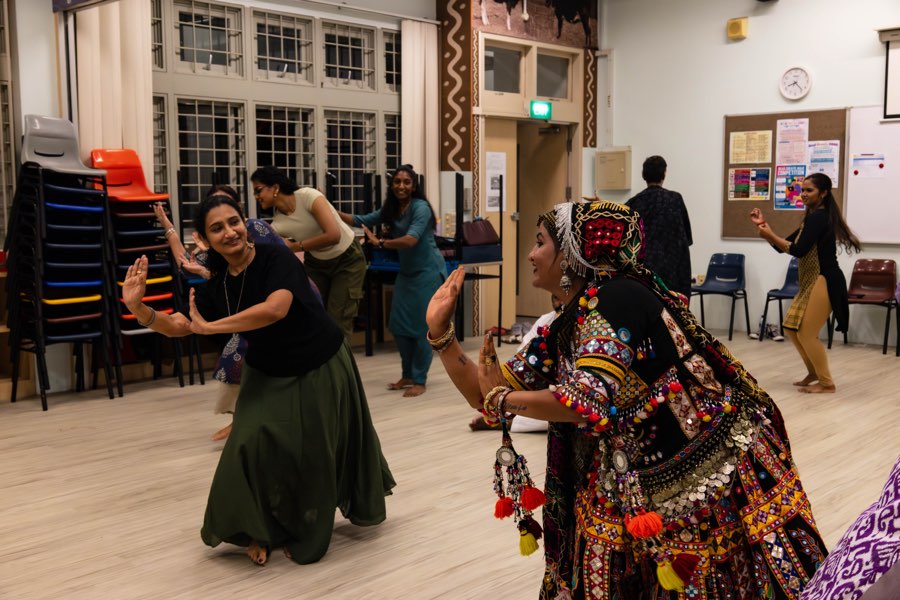 A Kalbeliya master artist leading participants through the steps