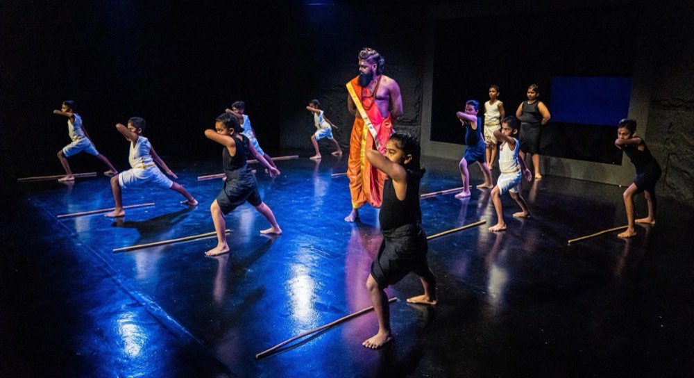 Kalaripayattu practitioners training with weapons